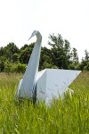 This contemporary metal garden sculpture is made in the form of a white swan. Image 11