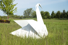 This contemporary metal garden sculpture is made in the form of a white swan. Image 3