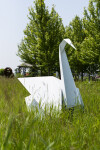 This contemporary metal garden sculpture is made in the form of a white swan. Image 10