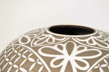 Delicately detailed floral petals adorn this elegant vessel by ceramicist Loren Kaplan. Image 3