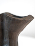 This contemporary ceramic black vessel in a floral shape is by Loren Kaplan. Image 10