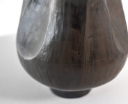 This contemporary ceramic black floral shaped vessel is by Loren Kaplan. Image 9