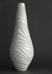 This contemporary white ceramic vessel is handmade.