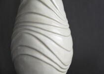 This contemporary white ceramic vessel is handmade. Image 5