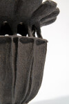 This contemporary ceramic vessel was inspired by nature and rendered in black. Image 5