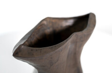 This contemporary ceramic black vessel in a floral shape is by Loren Kaplan. Image 6