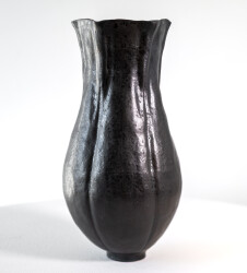 This contemporary ceramic black vase is by Loren Kaplan.