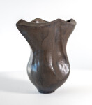 This contemporary ceramic black vessel in a floral shape is by Loren Kaplan. Image 3
