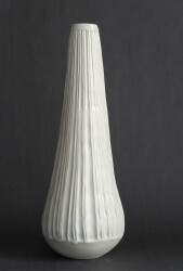 This contemporary white ceramic vessel is handmade.