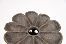 This contemporary ceramic vessel was inspired by nature and rendered in black. Image 3