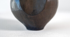 This contemporary ceramic black vessel in a floral shape is by Loren Kaplan. Image 8
