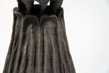 This contemporary ceramic vessel was inspired by nature and rendered in black. Image 5