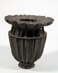 This contemporary ceramic vessel was inspired by nature and rendered in black. Image 2