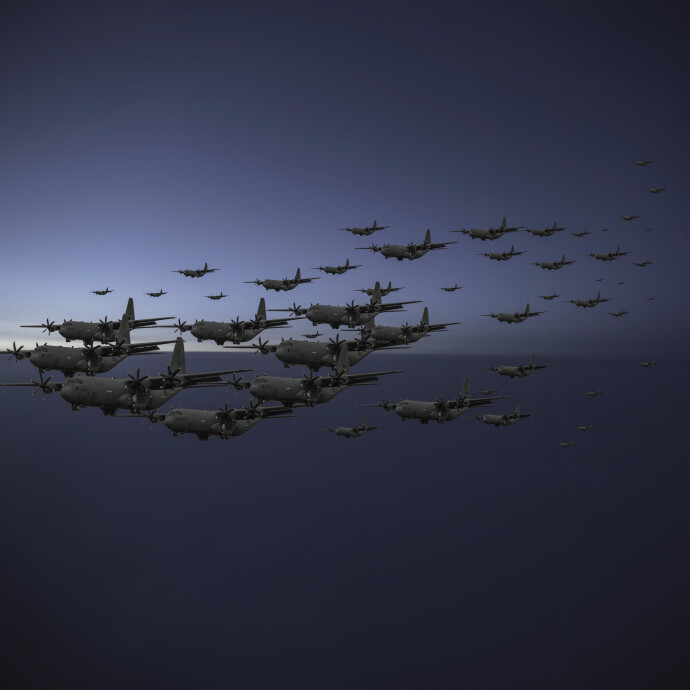 Military planes in formation is reminiscent of a flock of starlings in this eerily brilliant image by Mark Bartkiw.