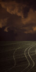 Unwinding tire tracks rise to meet a brooding sky in this dream-like image by Mark Bartkiw. Image 4