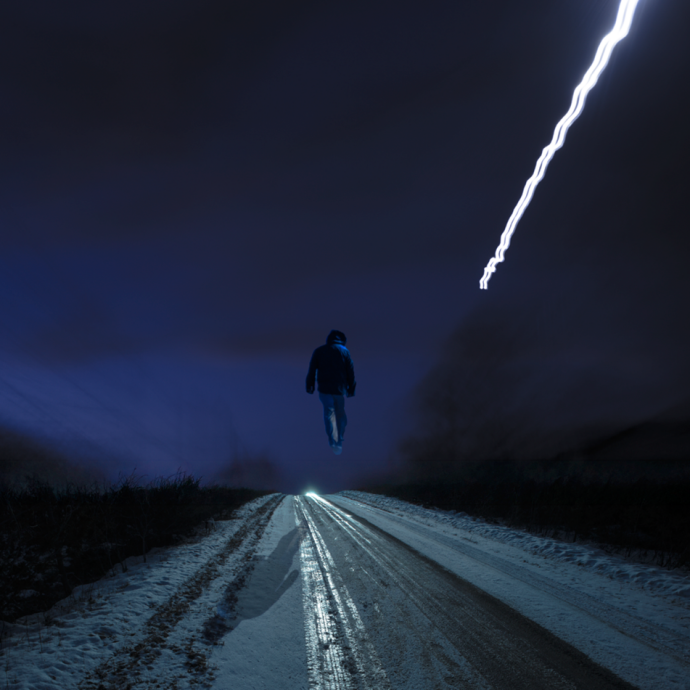This contemporary photograph by Mark Bartkiw of a figure walking in the countryside in winter is surreal.