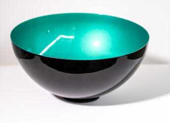 This green metal indoor sculpture was inspired by traditional singing bowls.