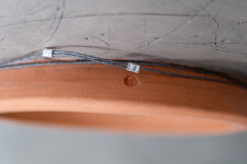 This contemporary wall sculpture is a handmade ceramic bowl. Image 7