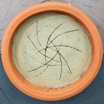 This contemporary wall sculpture is a handmade ceramic bowl. Image 6