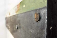 The textured surface of water, still and dark, meets a strip of cream coloured sky in this long horizontal canvas. Image 2