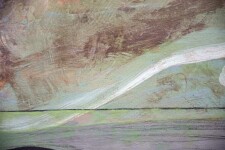 A rich black ground undulates at the horizon where it meets geometric passages of crimson, ochre, grey, white, and peach below a moss green … Image 3