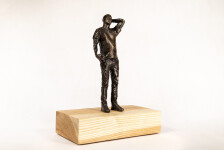 This bronze figurative table top sculpture by Roch Smith features a maple leaf. Image 3