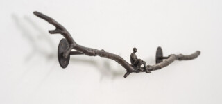 This contemporary indoor bronze figurative sculpture of a male is designed to be mounted on the wall. Image 3