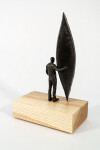 This bronze figurative tabletop sculpture by Roch Smith features a canoe. Image 3