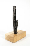 This bronze figurative tabletop sculpture by Roch Smith features a canoe. Image 2