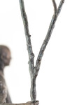 This indoor table top figurative sculpture of a male is cast in bronze. Image 9