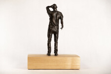 This bronze figurative table top sculpture by Roch Smith features a maple leaf. Image 5