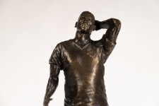 This bronze figurative table top sculpture by Roch Smith features a maple leaf. Image 4