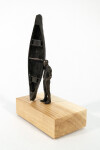 This bronze figurative tabletop sculpture by Roch Smith features a canoe. Image 5