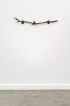 This contemporary indoor bronze figurative sculpture of a male is designed to be mounted on the wall. Image 2