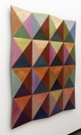 A kaleidoscope of vivid colours form triangular patterns in this engaging contemporary work by Parvis Djamtorki. Image 3