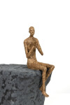 This contemporary figurative male table top sculpture is made from papier mâché. Image 8