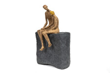 This contemporary figurative table top sculpture of a father and son is created from papier mâché. Image 3