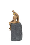 This contemporary figurative table top sculpture of a father and son is created from papier mâché. Image 4