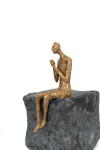 This contemporary figurative male table top sculpture is made from papier mâché. Image 9