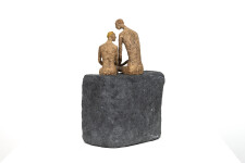 This contemporary figurative table top sculpture of a father and son is created from papier mâché. Image 5