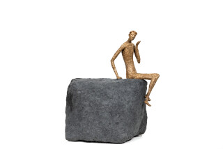 This contemporary figurative table top sculpture is made from papier mâché.