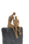 This contemporary figurative table top sculpture of a father and son is created from papier mâché. Image 6