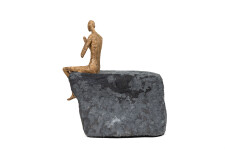 This contemporary figurative male table top sculpture is made from papier mâché. Image 4