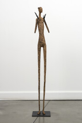 This contemporary figurative floor sculpture is created from papier mâché.