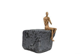 This contemporary figurative male table top sculpture is made from papier mâché.