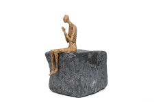 This contemporary figurative male table top sculpture is made from papier mâché. Image 3