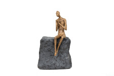 This contemporary figurative male table top sculpture is made from papier mâché. Image 2