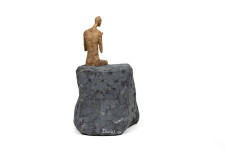 This contemporary figurative male table top sculpture is made from papier mâché. Image 5