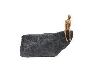 This contemporary figurative table top sculpture is made from papier mâché.