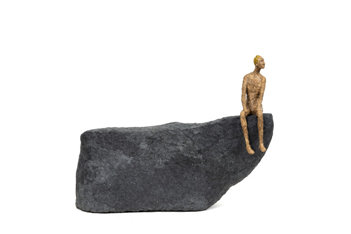 This contemporary figurative table top sculpture is made from papier mâché.